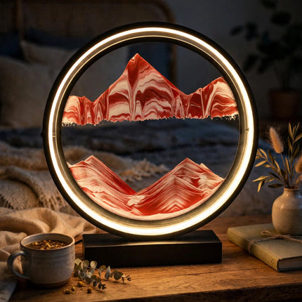 Sand art lamp glowing on a bedside table