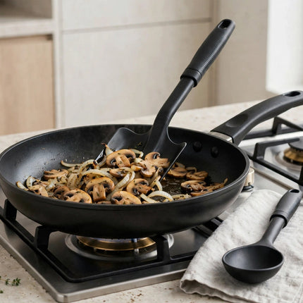 Turner flipping food in a non-stick pan